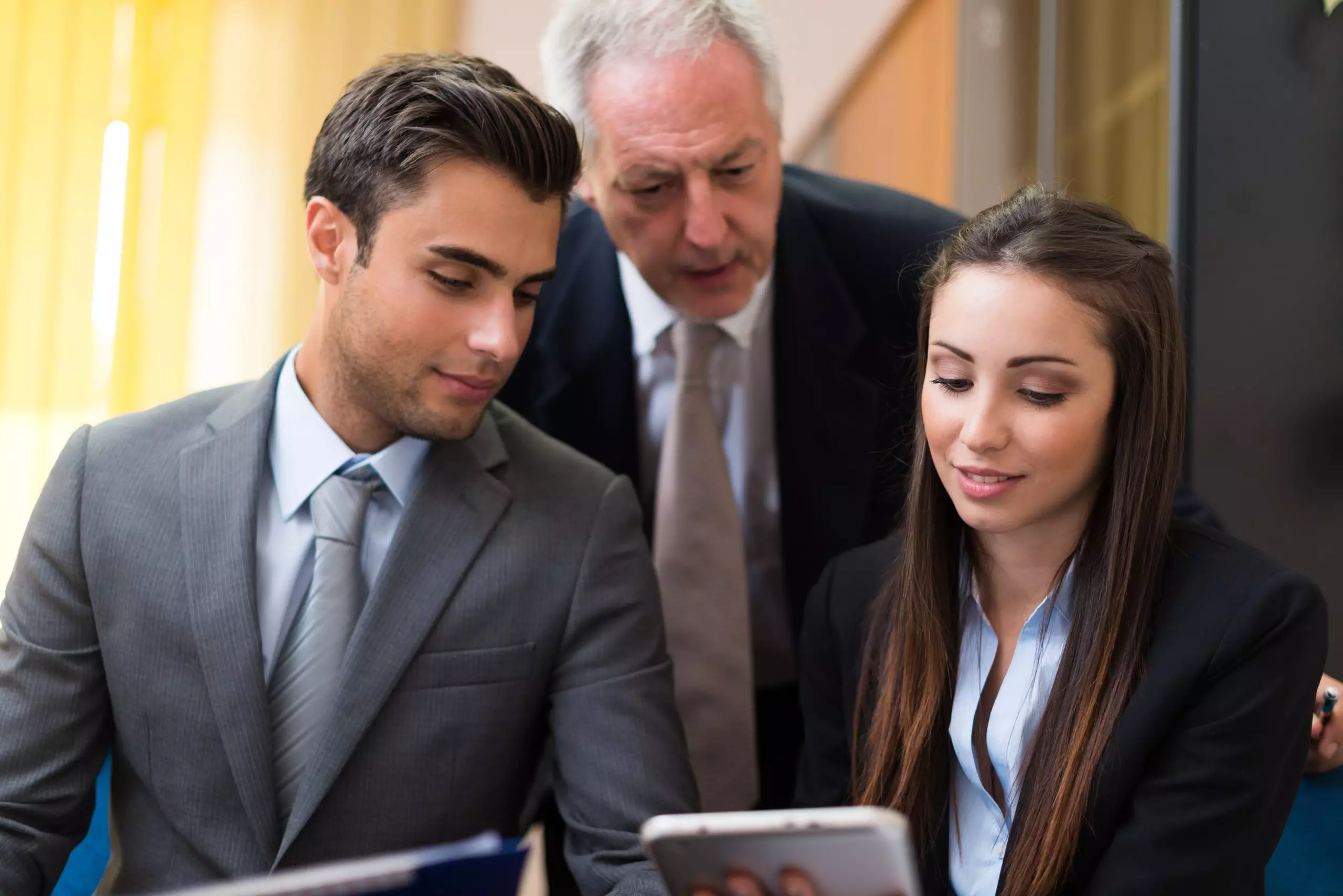 Business people working on a tablet